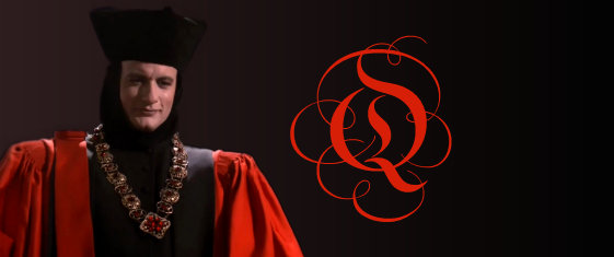 Q, wearing his judge's robes