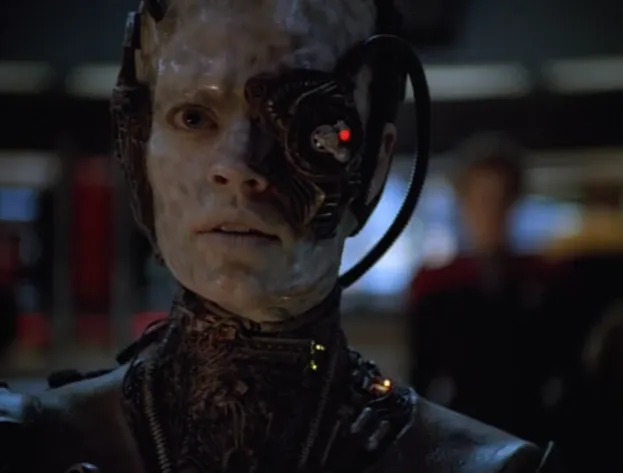 A fully-Borg Seven of Nine on the bridge of Voyager with Janeway in the background