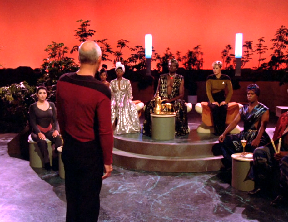 Picard addressing the assembled leaders after they have kidnapped Tasha