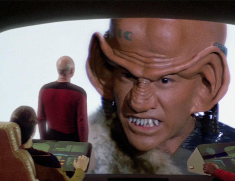 Picard addressing a Ferengi on the viewscreen