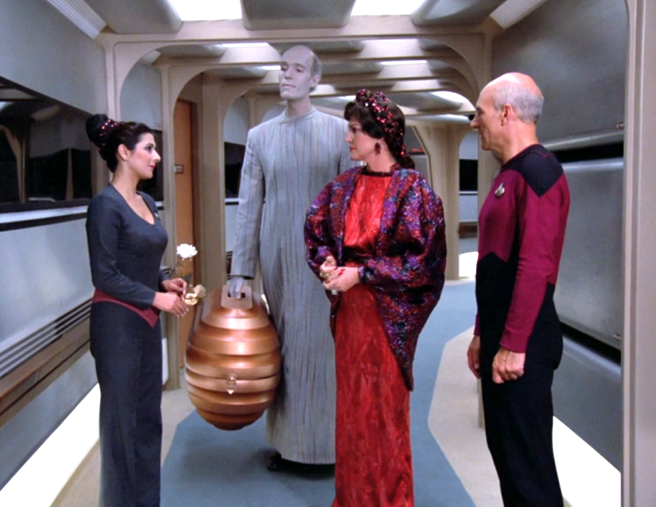 Troi, her mother Lwaxana, Picard, and Lwaxana's valet, Mr. Homn