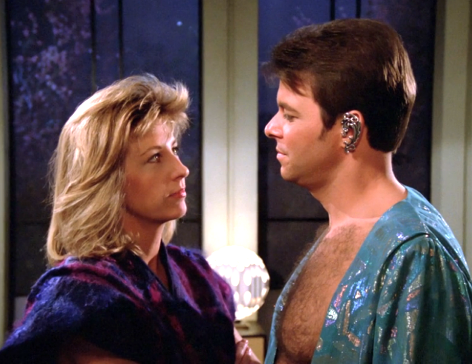 Riker speaking with the planet's leader, Beata