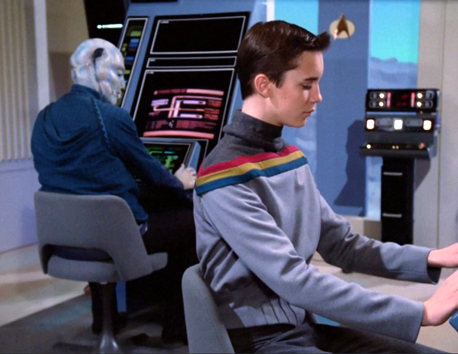 Wesley sitting at a computer terminal taking an exam for Starfleet Academy