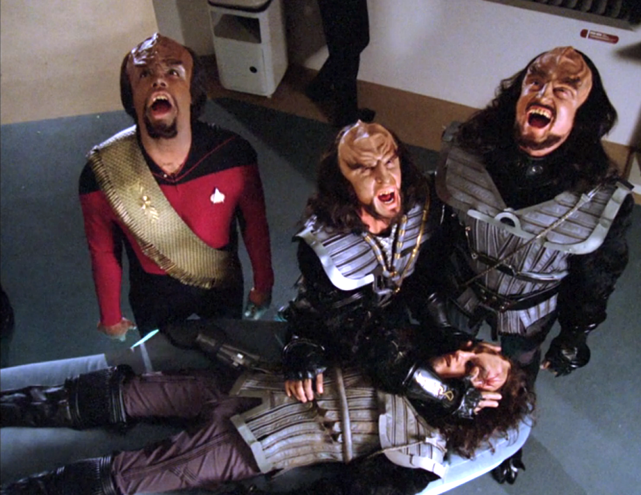 Worf and two other Klingons howling over the body of a deceased comrade