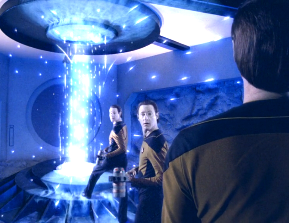 Three versions of Data across three different timeframes standing in front of a brilliant column of energy