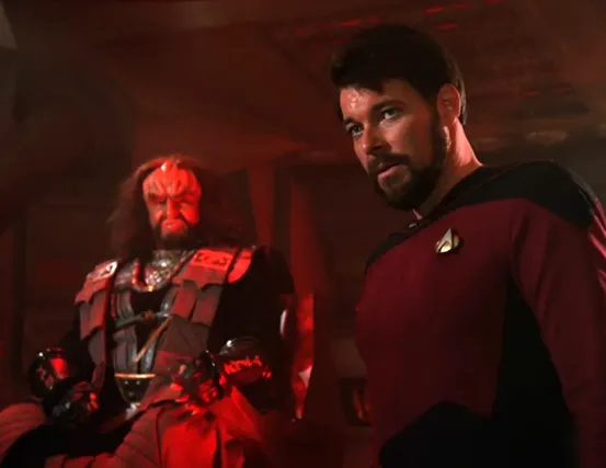 Riker on a Klingon bridge, under the watchful eye of its commander