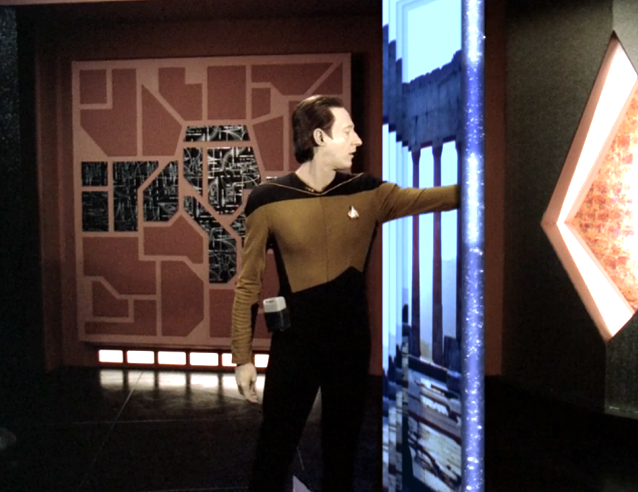 Data sticking his arm through a portal