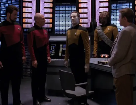 Dr. Stubbs watching as the microscopic life forms use Data as a conduit for communication