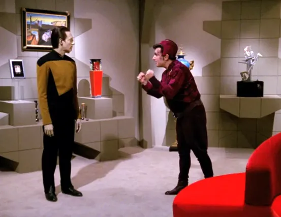 Kivas Fajo speaking with Data in his gallery of rarities
