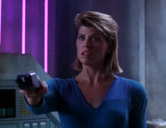 Ishara Yar holding a phaser