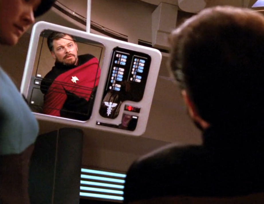 An aged Riker regarding himself in the mirror