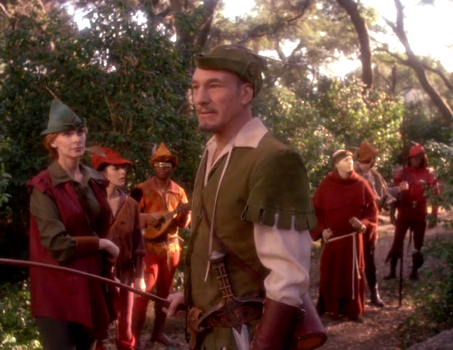 Picard and the senior staff in costumes resembling Robin Hood and his merry men