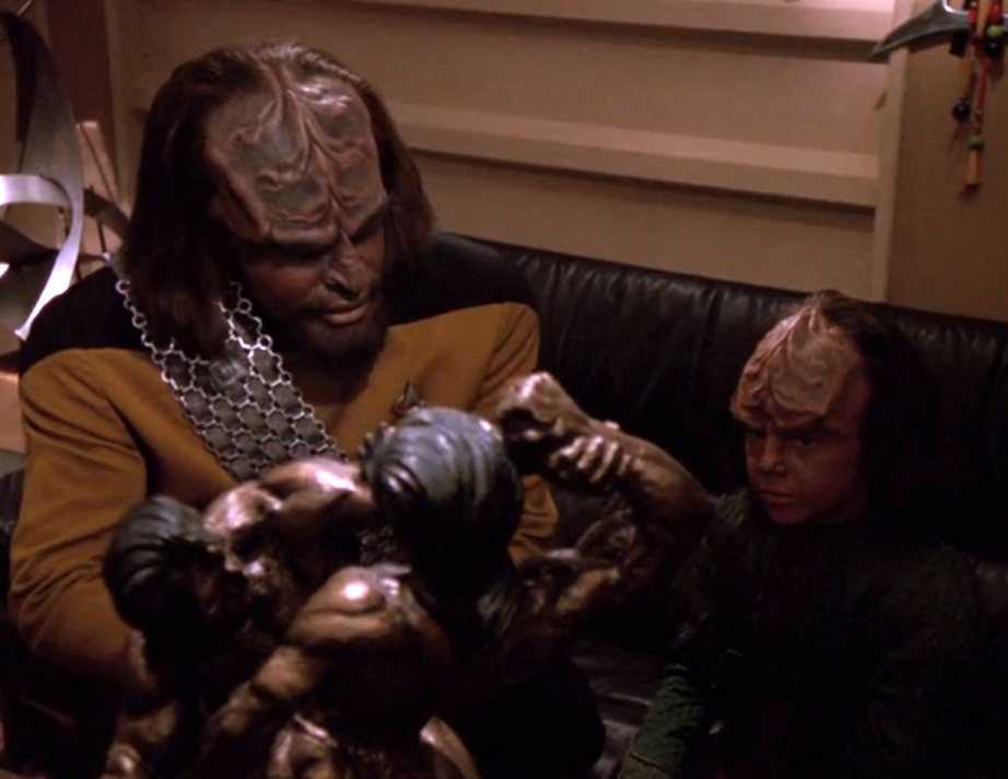 Worf telling Alexander about Klingon history as he explains a statue of Kahless and his brother
