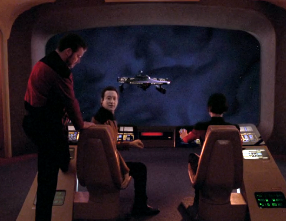 Data turning around in his chair to suggest a course of action regarding an approaching ship on the viewscreen