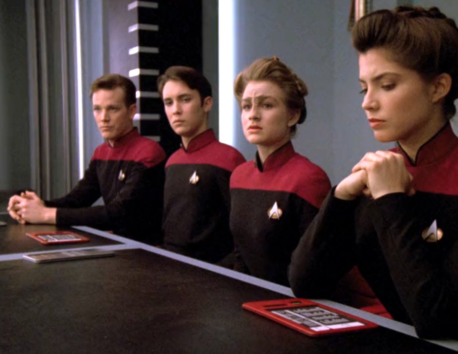 Wesley Crusher and three other cadets facing a board of inquiry