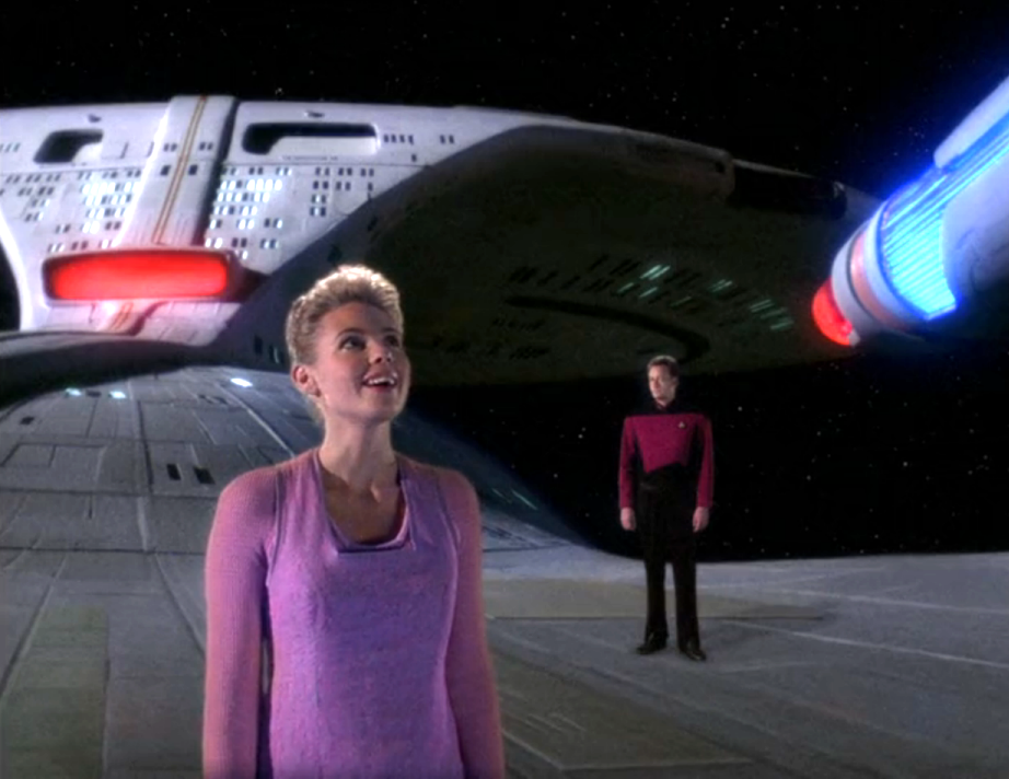 Q and Amanda Rogers standing on the outer hull of the Enterprise