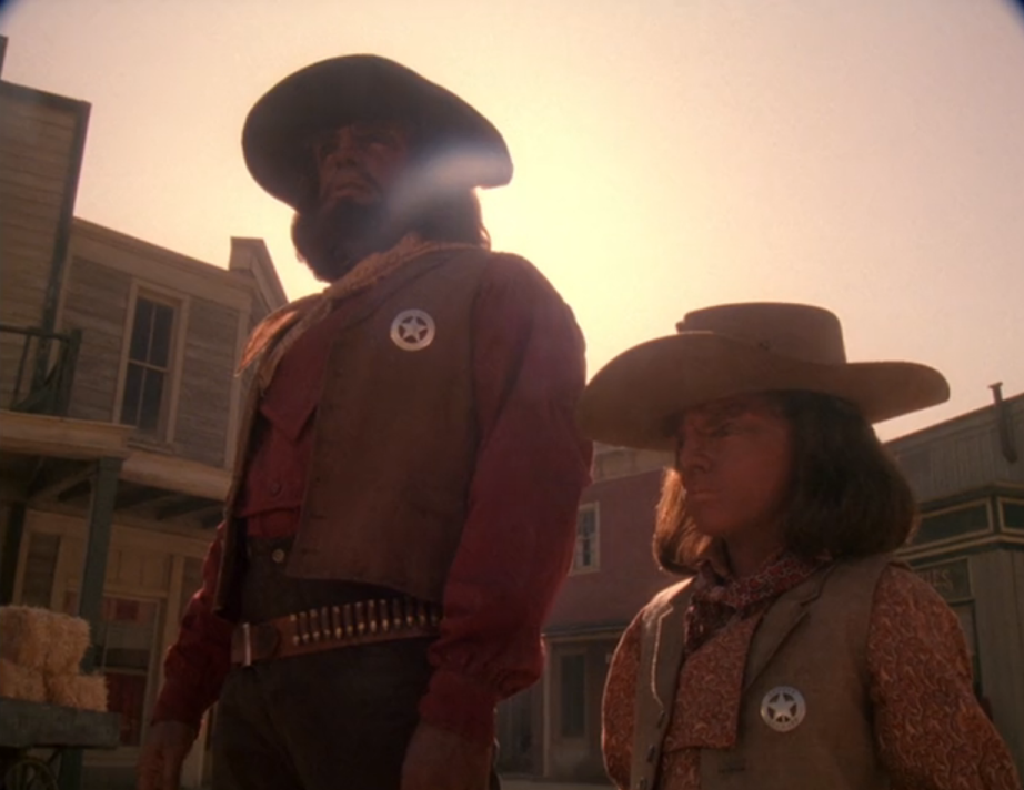 Worf and Alexander wearing sheriff's uniforms in the old west