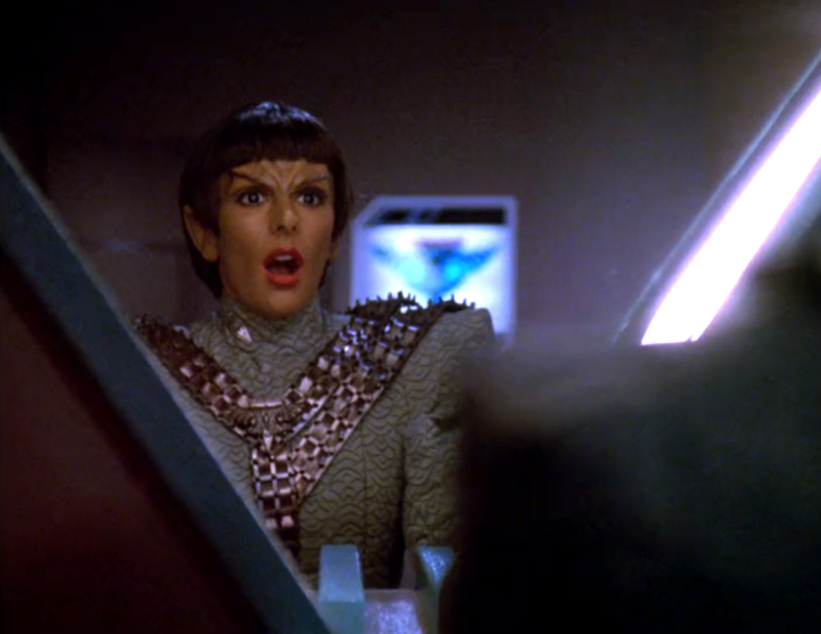 Deanna Troi gasping as she looks in the mirror and discovers that she's been altered to look like a Romulan