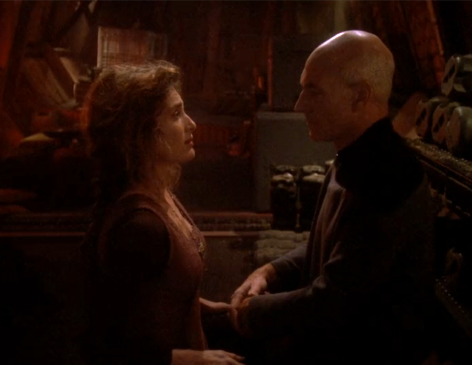 Picard speaking with a woman in a cargo ship