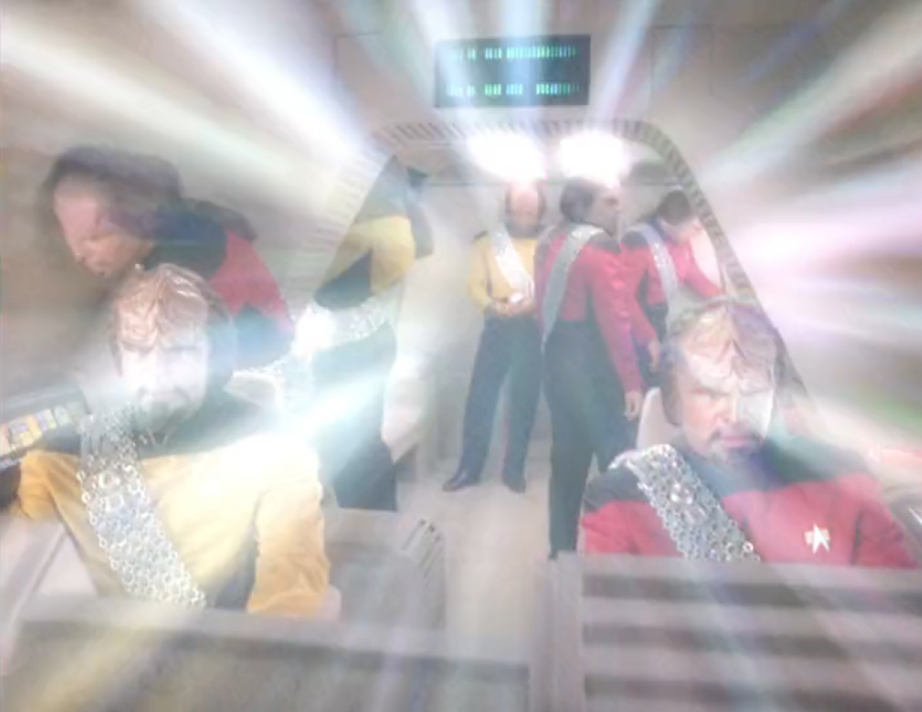 Several different versions of Worf, each standing in a different part of a shuttlecraft