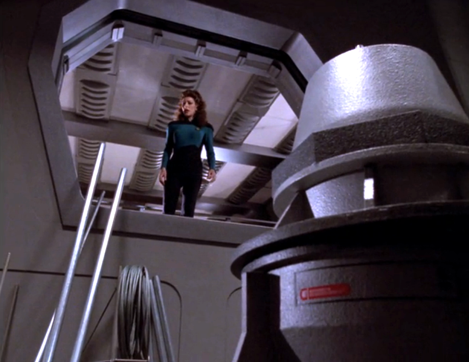 Troi investigating an abandoned warp nacelle tube