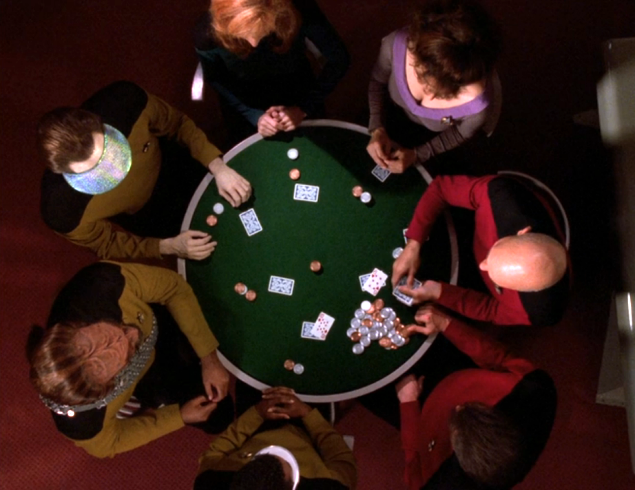 A bird's-eye view of Picard, Riker, La Forge, Worf, Data, Crusher, and Troi, playing poker around a circular table