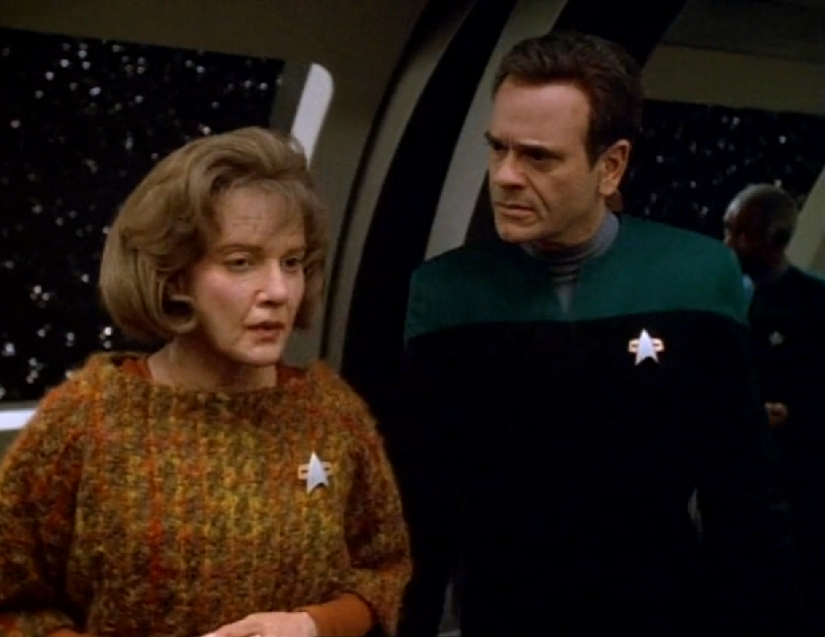 An aged Kes speaking with the Doctor, who has a full head of hair