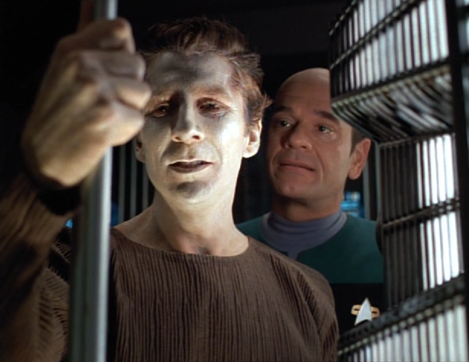 The Doctor looking after a concerned-looking man with pale skin