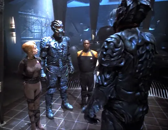 Seven and Tuvok are bound as two Hirogen over seven feet tall discuss their fate