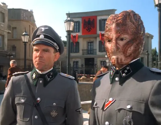 A human and a Hirogen hunter wearing WWII Nazi uniforms