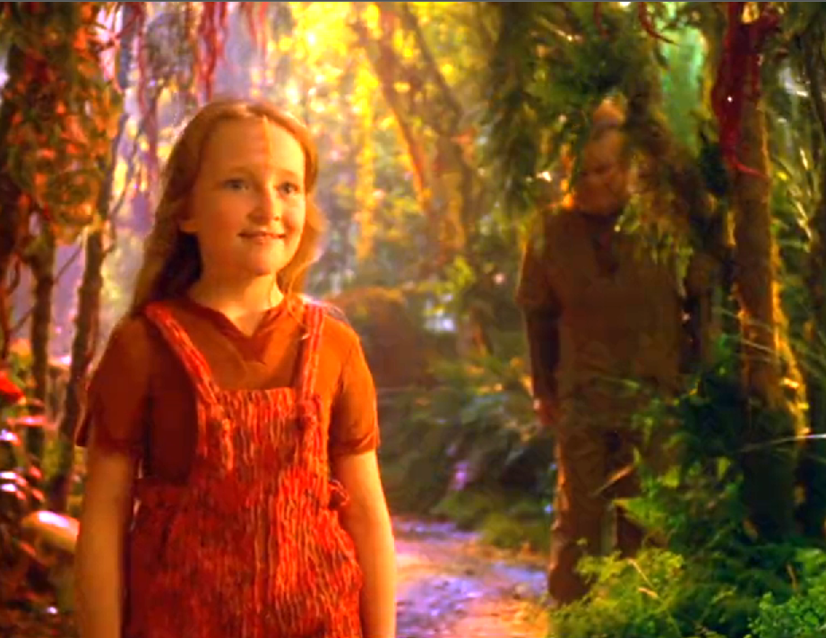 Naomi smiling in a brightly-lit, color forest while Neelix watches nearby