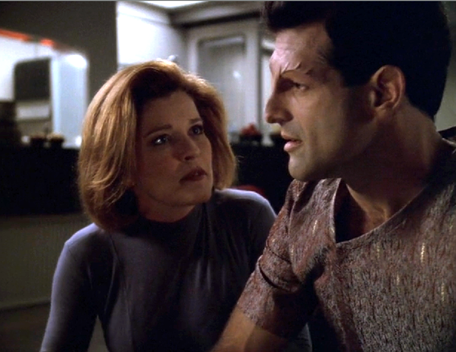 Janeway and the Devore inspector having a conversation in the mess hall