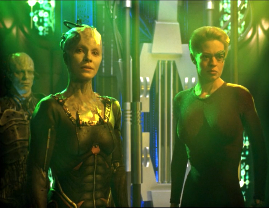 Seven of Nine and the Borg Queen standing in a Borg chamber