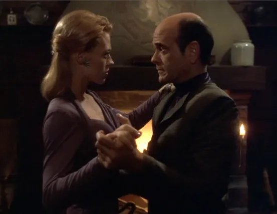 Seven and the Doctor, in evening attire, dancing