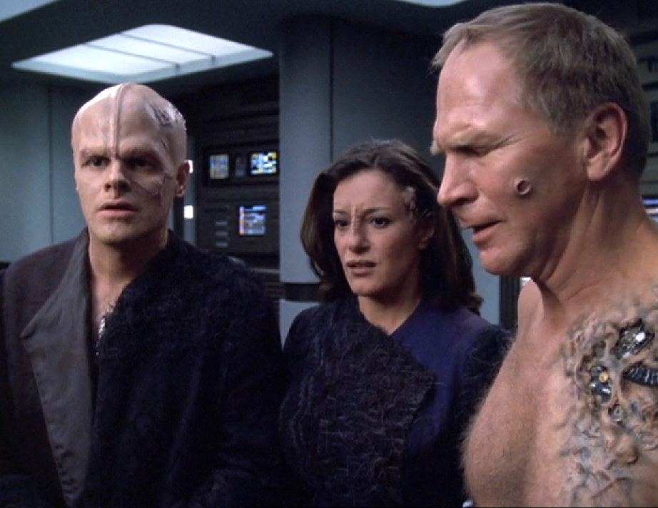 Three former Borg with various remaining implants