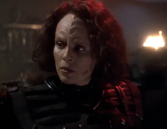 Torres wearing Klingon armor with a scar on her left cheek