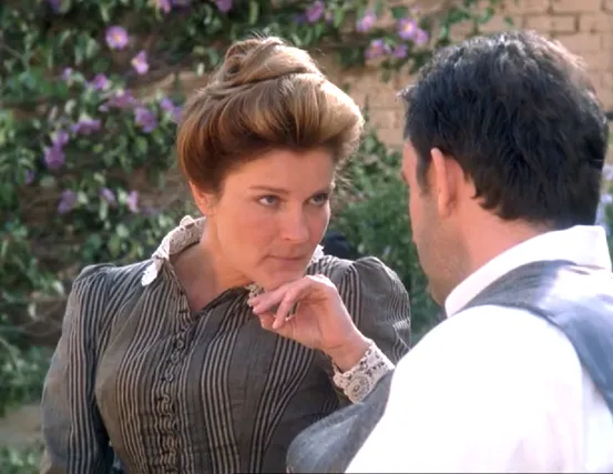 Captain Janeway, in a 19th century dress, speaking with Fair Haven's pub owner, Michael Sullivan