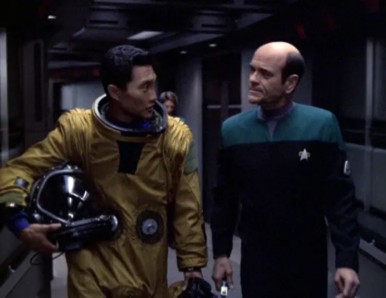 The Doctor speaking with one of the aliens who managed to board Voyager