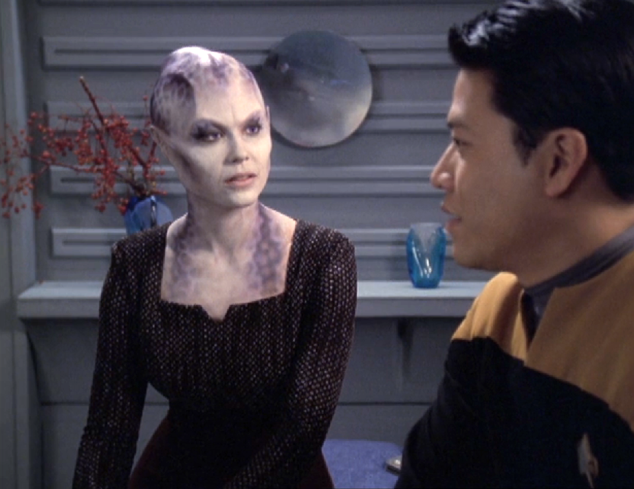 Harry Kim speaking with a very alien-looking Ensign Ballard