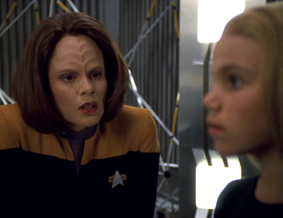 Torres looking closely at a holographic extrapolation of her unborn child